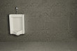 Urinal on dirty wall. Abstract background