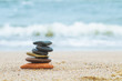 Stack of beach stones on sand. Harmony, life, balance