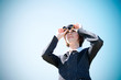 Young caucasian business lady with binoculars Young caucasian business lady with binoculars