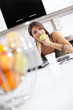 Modern woman reading e-mails at her breakfast