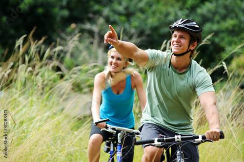 Photo: mountainbike couple outdoors mountainbike couple outdoors