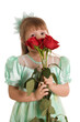 The little girl with a bouquet of roses