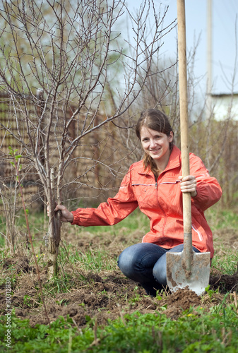 Photo: woman working with shovel woman working with shovel