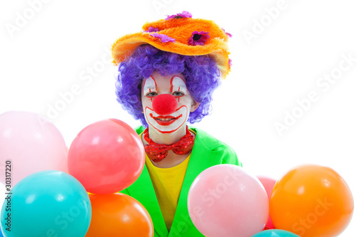 Photo: child dressed as colorful funny clown over white background child dressed as colorful funny clown over white background