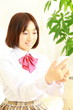 Foto: Female student with a smart phone Female student with a smart phone