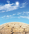 Planet with cracks against the solar sky
