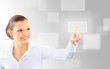 Attractive brunette with interface in futuristic interior