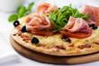 Pizza with prosciutto,tomatoes and rocket Pizza with prosciutto,tomatoes and rocket