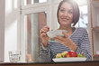 young woman having breakfast young woman having breakfast