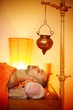 Man having a shirodhara massage in a salon