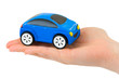 Hand and toy car