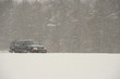SUV driving during a blizzard