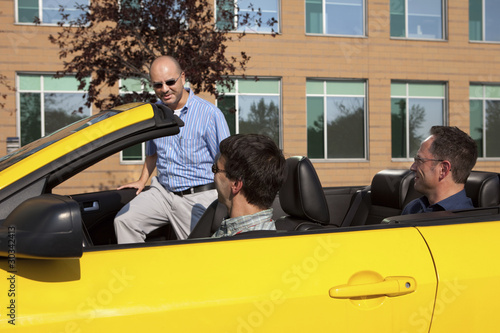 Photo: Work colleagues car pooling from the office Work colleagues car pooling from the office
