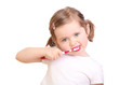 Foto: Little girl brushing her teeth isolated on white background Little girl brushing her teeth isolated on white background
