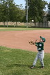 Young boy tossing baseball