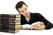 The young student with the books isolated on a white The young student with the books isolated on a white