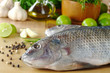 Raw fish called "tilapia" surrounded by spices