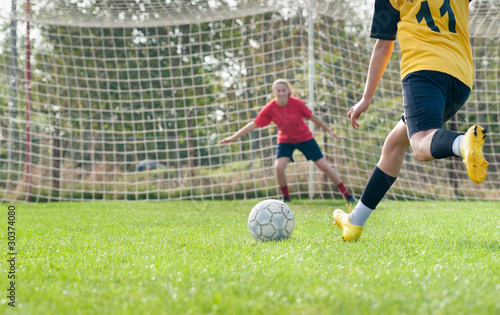 Photo: kicking and Defending in soccer kicking and Defending in soccer