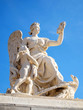 Statue at facade of Versailles Chateau entrance