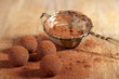 chocolate truffles cocoa powder dusted and sieve, shallow dof