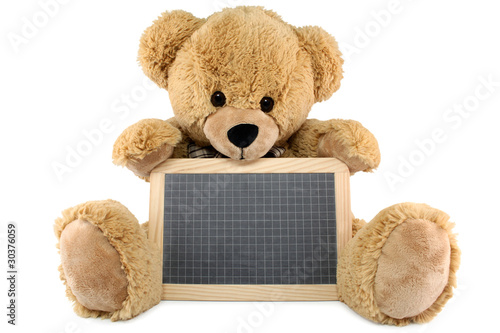Photo: Ours brun en peluche avec une ardoise Ours brun en peluche avec une ardoise