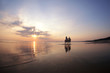 People in love at sunset in the sea