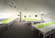 large bright dining room with white tables and chairs