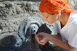 beautiful young woman in red kerchief drinking water beautiful young woman in red kerchief drinking water
