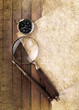Compass and magnifier on textured paper
