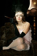 The girl in style 30 on an armchair The girl in style 30 on an armchair