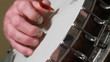 Old Hand Playing Banjo Three