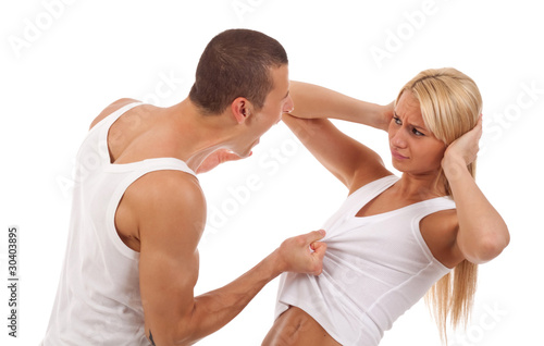 Photo: man screaming and pulling his girlfriend's shirt man screaming and pulling his girlfriend's shirt