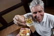 Foto: Drinking in moderation man with small glass of beer Drinking in moderation man with small glass of beer