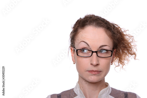Photo: Young woman surprised sceptic look isolated on white Young woman surprised sceptic look isolated on white