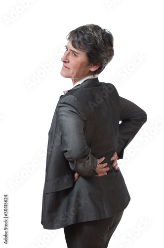 Photo: mature businesswoman with kidney ache isolated on white mature businesswoman with kidney ache isolated on white