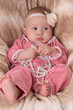Cute baby girl in a pink dress