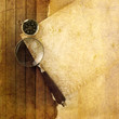 compass with magnifying glass on wooden background