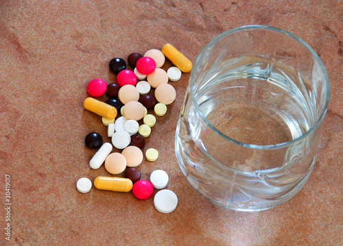 Photo: Pills and water glass Pills and water glass