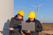 Two Engineers in Wind Turbine Power Generator Station