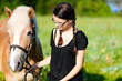 Teenage girl with horse