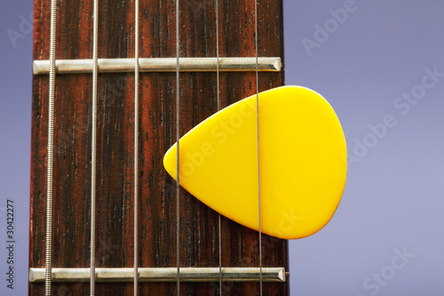 Photo: Plectrum between strings Plectrum between strings