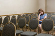 Woman at a boring conference
