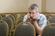 Man at a boring conference