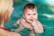 Swimming baby in pool water Swimming baby in pool water