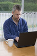 Businessman working from home in pajamas