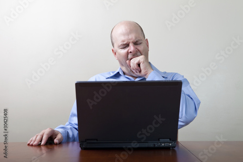Photo: Bored yawning businessman Bored yawning businessman