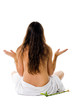 Beautiful young woman in towel sitting on the floor in white bac
