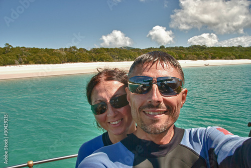Photo: Young Couple having Fun in Whitehaven Beach Young Couple having Fun in Whitehaven Beach