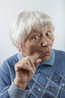 Reminding senior woman head and shoulders portrait