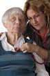 Female doctor examining senior patient